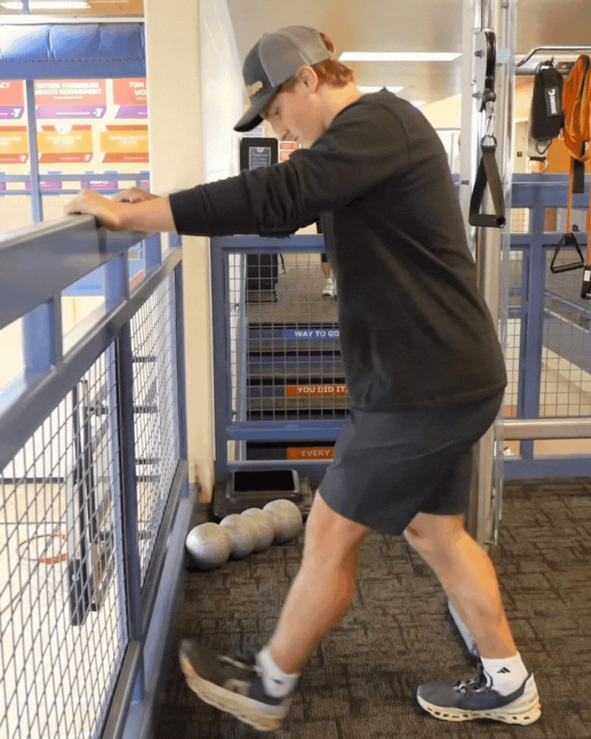 An animated gif of a calf stretch