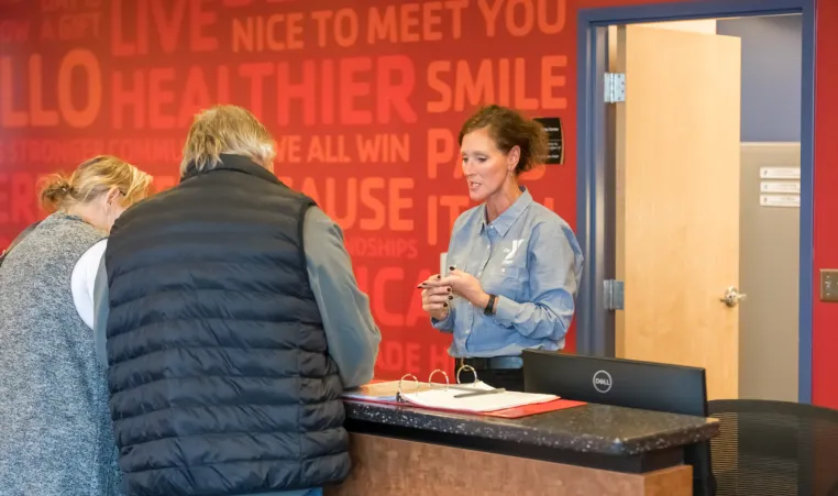 members checking in at the YMCA front desk