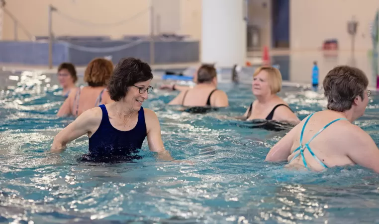 seniors in a water aerobics class