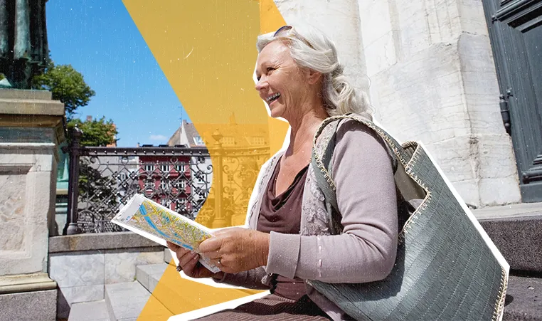 woman sitting on the steps looking at a map