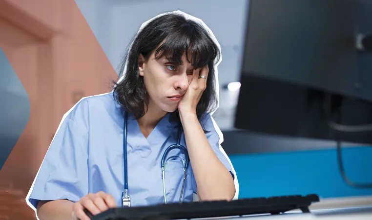 tired woman using a desktop computer