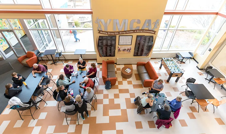 group of people sitting in the YMCA lobby