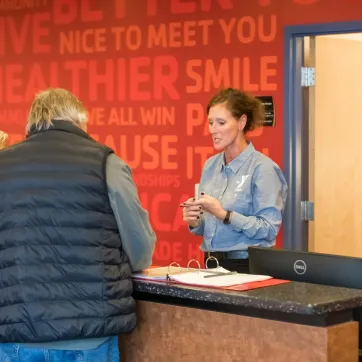 members checking in at the YMCA front desk