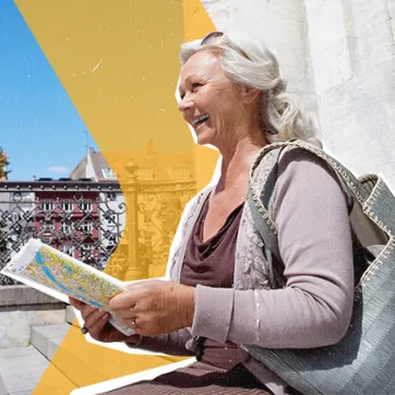woman sitting on the steps looking at a map